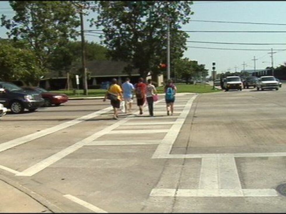 A group of McNeese freshmen use the crosswalk at the intersection of McNeese and Common on...
