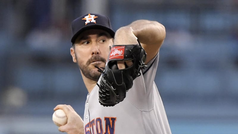 Houston Astros starting pitcher Justin Verlander throws during the first inning of the team's...