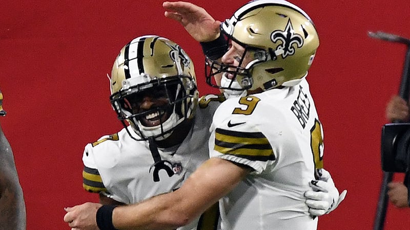 New Orleans Saints quarterback Drew Brees (9) celebrates with wide receiver Emmanuel Sanders...