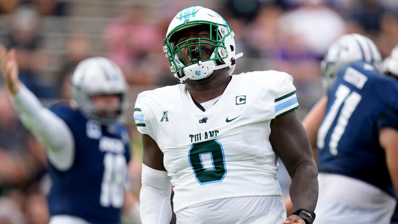 Tulane defensive lineman Patrick Jenkins reacts after a first-half tackle against Rice on...