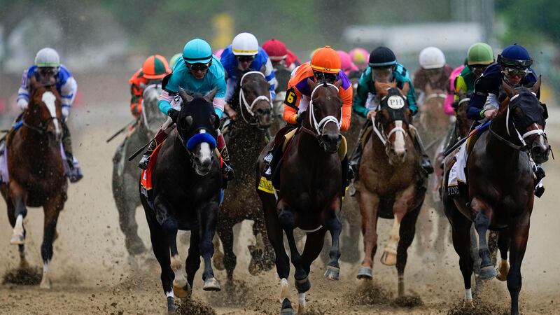 Horses compete the 149th running of the Kentucky Derby horse race at Churchill Downs Saturday,...