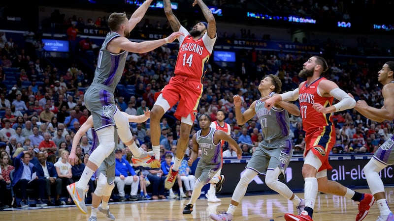 Pelicans forward Brandon Ingram (14) shoots against Sacramento Kings forward Domantas Sabonis,...
